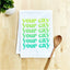 a tea towel with a spoon on top of it