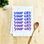 a tea towel that says your city is your city