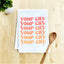 a tea towel with a spoon next to it