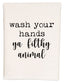 a white dish towel with black lettering that says wash your hands, ya filthy animal