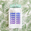 a towel hanging on a wall with palm leaves