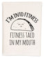 a towel that says i'm into fitness and a taco in my mouth