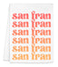 a white towel with an orange and red design on it