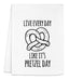 a white towel with a pretzel on it